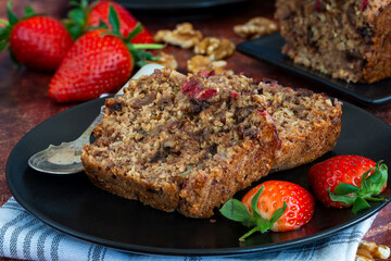 Baked dates and rolled oats loaf with strawberries and walnuts