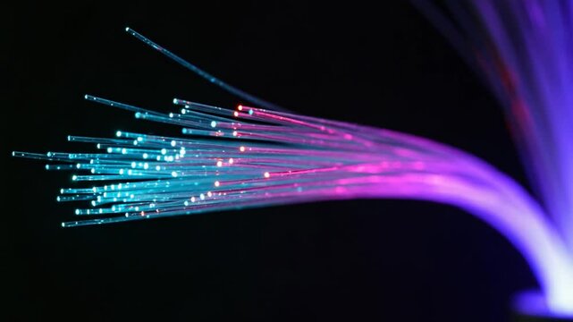 Fiber Optic Cables: Dynamic Light Display with Data Transmission and Connectivity.