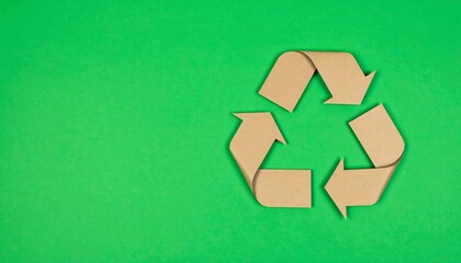 Cardboard recycling symbol on green background (1)