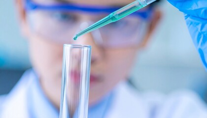 A scientist carefully studies a chemical test in a laboratory. The scientific experiment is conducted with precision