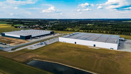 Modern factory buildings near agriculture land