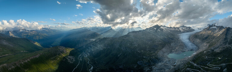 Panoramic view of summer landscape in the Swiss Alps , Furka pass with glacier