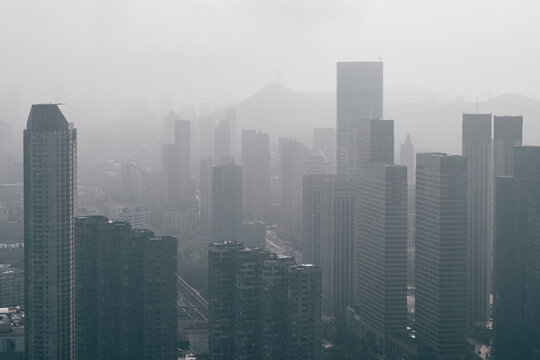 modern city buildings and downtown area in morning mist