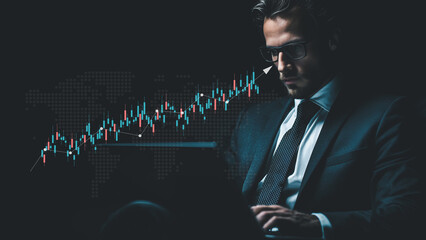 Businessman uses laptop analyzing financial chart with global market data trends.
