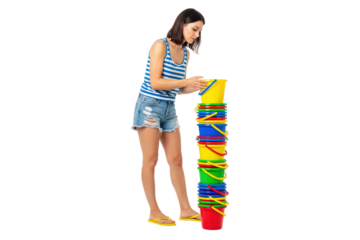Woman stacking colorful beach buckets