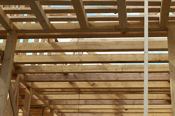 Elements of wooden frame house building structure.