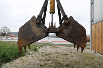 A large piece of equipment with a claw on the front