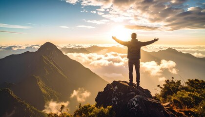 man standing on top of the mountain