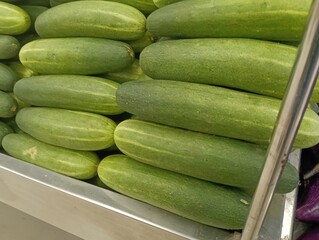 ripe fresh  green cucumber,(Cucumis sativus) close up on market stall. photo taken in malaysia