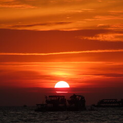 Obraz premium sunset with shadows of ships at sea