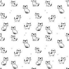 Fototapeta premium Seamless pattern with cute black and white cartoon kittens and paw prints on white background, playful cat design for fabric, wallpaper, and pet-themed projects