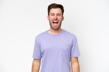 Obraz premium Young caucasian man isolated on white background shouting to the front with mouth wide open