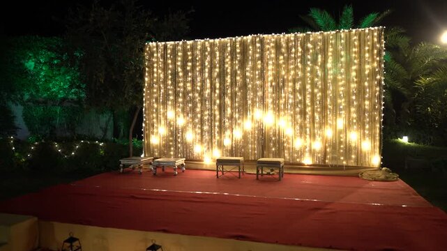 Indian Wedding Stage Decorated for Pooja Ritual with Fairy Lights Backdrop