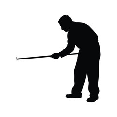 Silhouette of a man leaning and holding a long stick or pole
