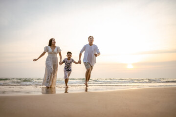 Family holiday vacation beach. Asian happy family outdoors summer travel. Fun families outdoors. Family vacation beach. Life assurance plan. Families financial planning Joyful relaxing Playing outside