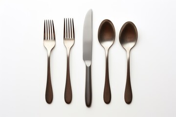 Silverware set neatly arranged on a white background, creating a stylish and elegant table setting