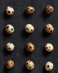 Obraz premium Overhead Shot Of Quail Eggs On Dark Textured Background