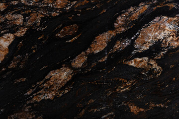 Natural Black Magma granite texture, strict background in dark color.