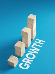 Wooden blocks forming increasing graph showing growth