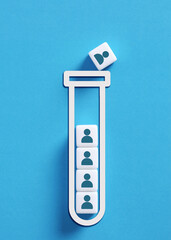 Test tube losing people cubes showing employee turnover concept