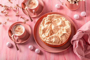 Homemade meringue cheesecake served with frappuccino coffee
