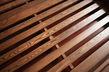 close up of a wooden bed.