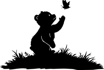 Fototapeta premium Bear Cub Reaching for Butterfly Silhouette on Grassy Hill