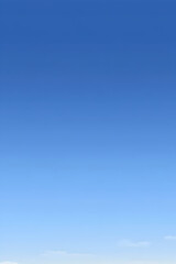 A clear blue sky with minimal cloud cover.