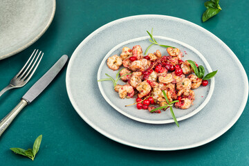 Fried seafood shrimps with berries sauce.