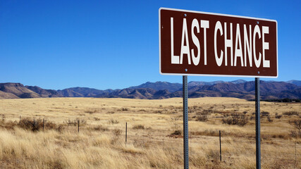 Last chance brown road sign