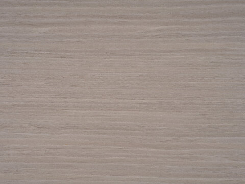 Gentle gradients of gray and muted earth tones cascade across the sturdy ash wood veneer, offering a canvas of understated elegance