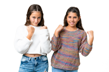 Friends girls over isolated chroma key background celebrating a victory in winner position