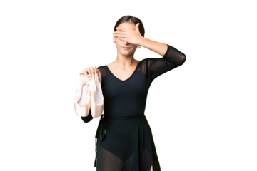 Young woman practicing ballet over isolated chroma key background covering eyes by hands. Do not want to see something
