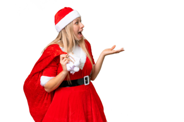 Young blonde woman with christmas hat over isolated chroma key background with surprise facial expression