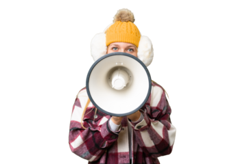 Young pretty blonde woman wearing winter muffs over isolated chroma key background shouting through a megaphone