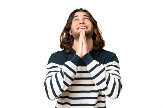 Young handsome man over isolated background keeps palm together. Person asks for something