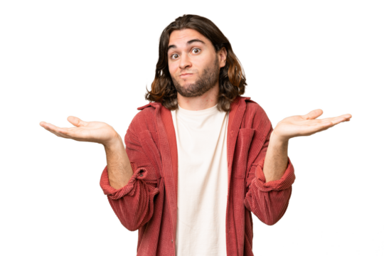 Young handsome man over isolated background having doubts while raising hands