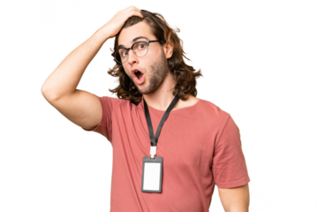 Young handsome man with ID card over isolated background doing surprise gesture while looking to the side