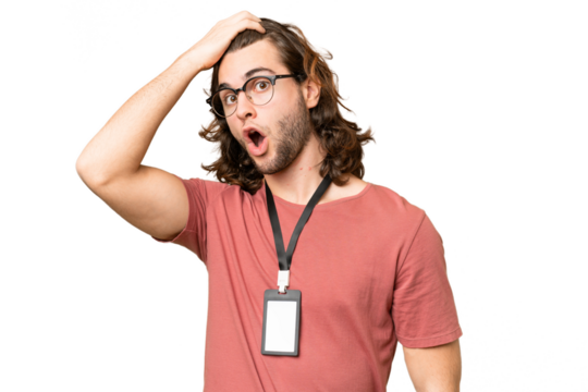 Young handsome man with ID card over isolated background doing surprise gesture while looking to the side