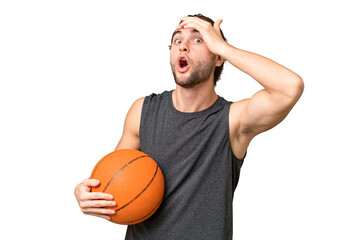 Obraz premium Young basketball player man over isolated background doing surprise gesture while looking to the side