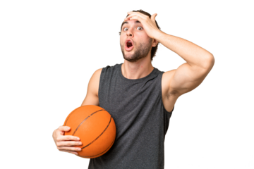 Young basketball player man over isolated background doing surprise gesture while looking to the side