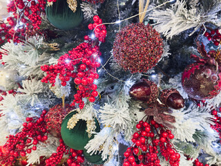 close up white snow Christmas tree with decoration ball and light bulb on festival time celebrations