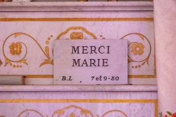 Marble plaque Merci Marie inside a Corsican church, France, Corsica, Cargèse, 15 June 2025