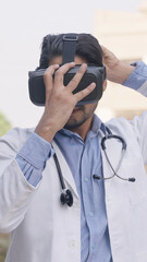 Vertical Photo of Indian Doctor Wearing VR headset, Virtual Reality