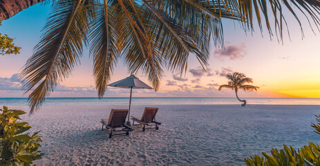 Gorgeous romantic sunset with beach chairs umbrella leisure lifestyle tropical coast summer vacation tourism holiday background palm trees ocean view sky silhouette peaceful nature travel destination