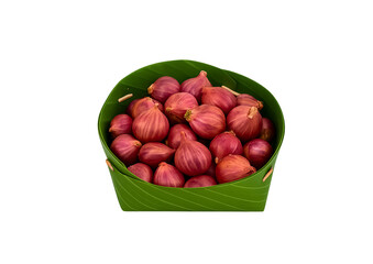 shallots,redshallots,thaishallot,freshshallots,shallotingreenbasket,bananaleafbasket,onionfamily,herbingredient,thaifoodingredient,asianshallots,naturalcooking,organicshal