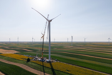 Wind turbine installation using a large construction crane. The assembly process of the turbine...