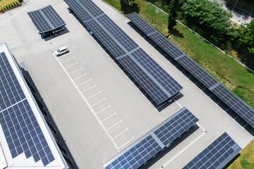 Obraz premium Aerial view of parking space with solar canopies