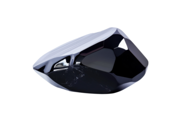 A black gem on display on transparent background
