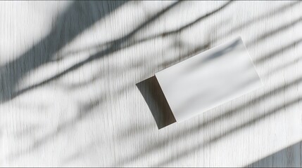 A blank notecard on light wood, embodying simplicity and natural beauty.